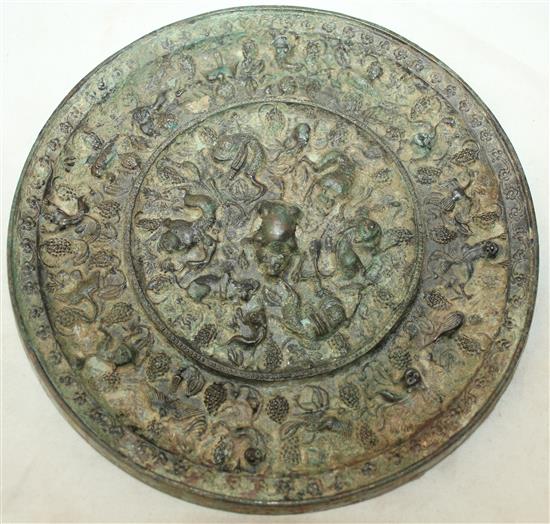 A Chinese bronze grapevine circular mirror, Tang Dynasty, 20.5cm